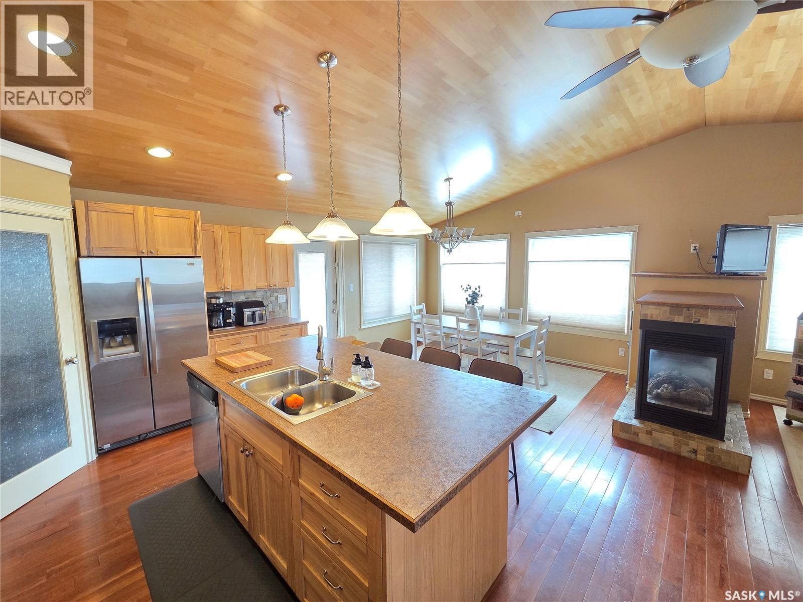 214 5Th Street, Milestone, SK - Indoor Photo Showing Kitchen With Fireplace With Double Sink