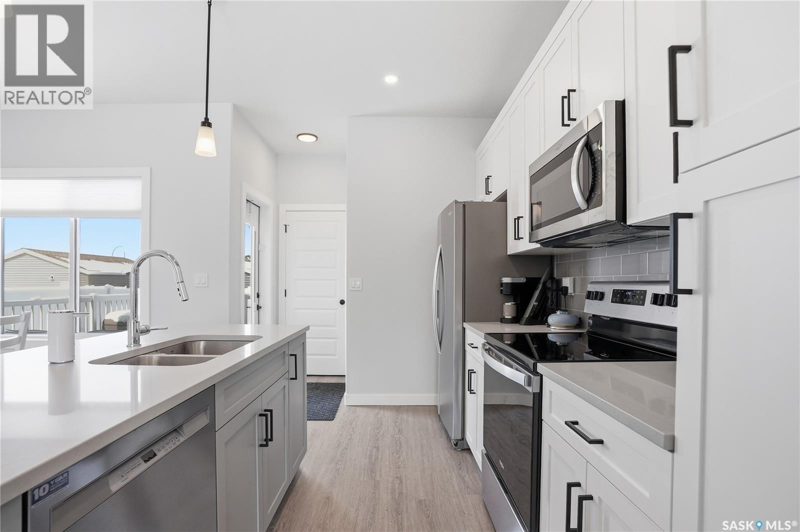 1047 Brighton Gate, Saskatoon, SK - Indoor Photo Showing Kitchen With Stainless Steel Kitchen With Double Sink With Upgraded Kitchen