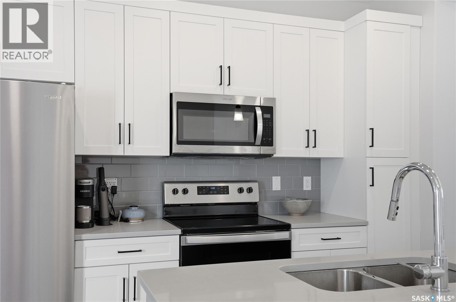 1047 Brighton Gate, Saskatoon, SK - Indoor Photo Showing Kitchen With Stainless Steel Kitchen With Double Sink With Upgraded Kitchen