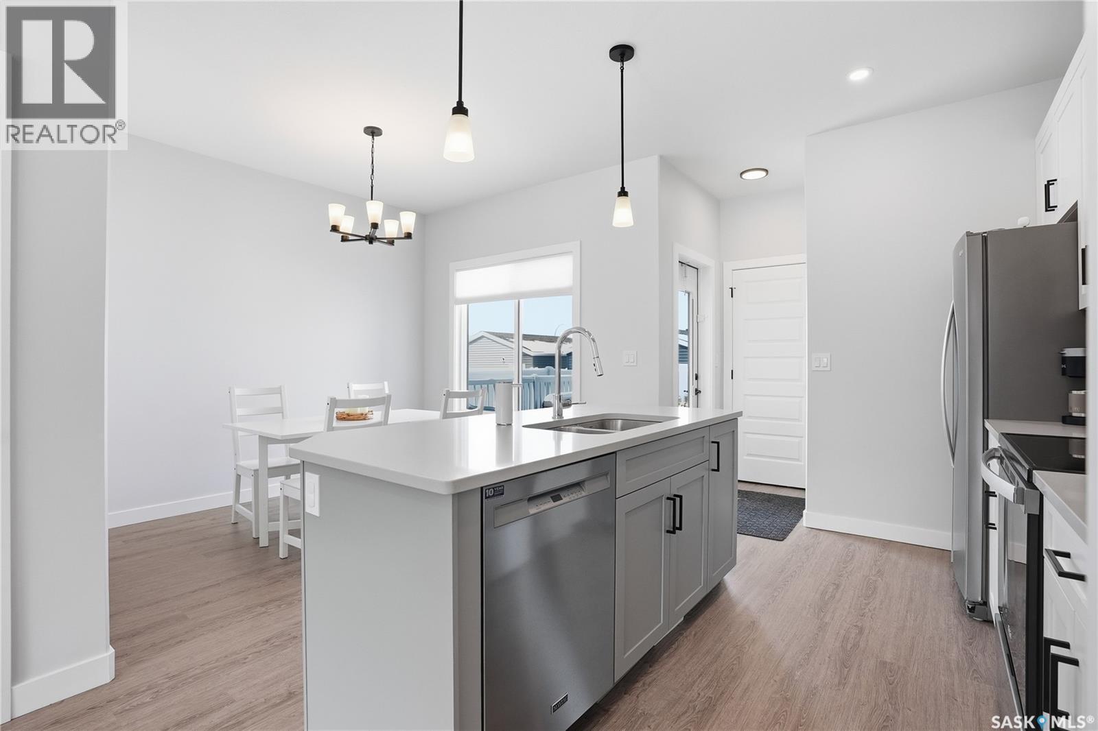 1047 Brighton Gate, Saskatoon, SK - Indoor Photo Showing Kitchen With Stainless Steel Kitchen With Double Sink With Upgraded Kitchen