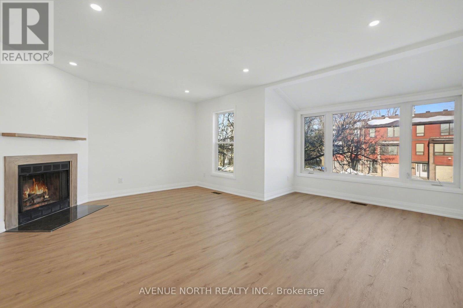4 Marielle Court, Ottawa, ON - Indoor Photo Showing Living Room With Fireplace