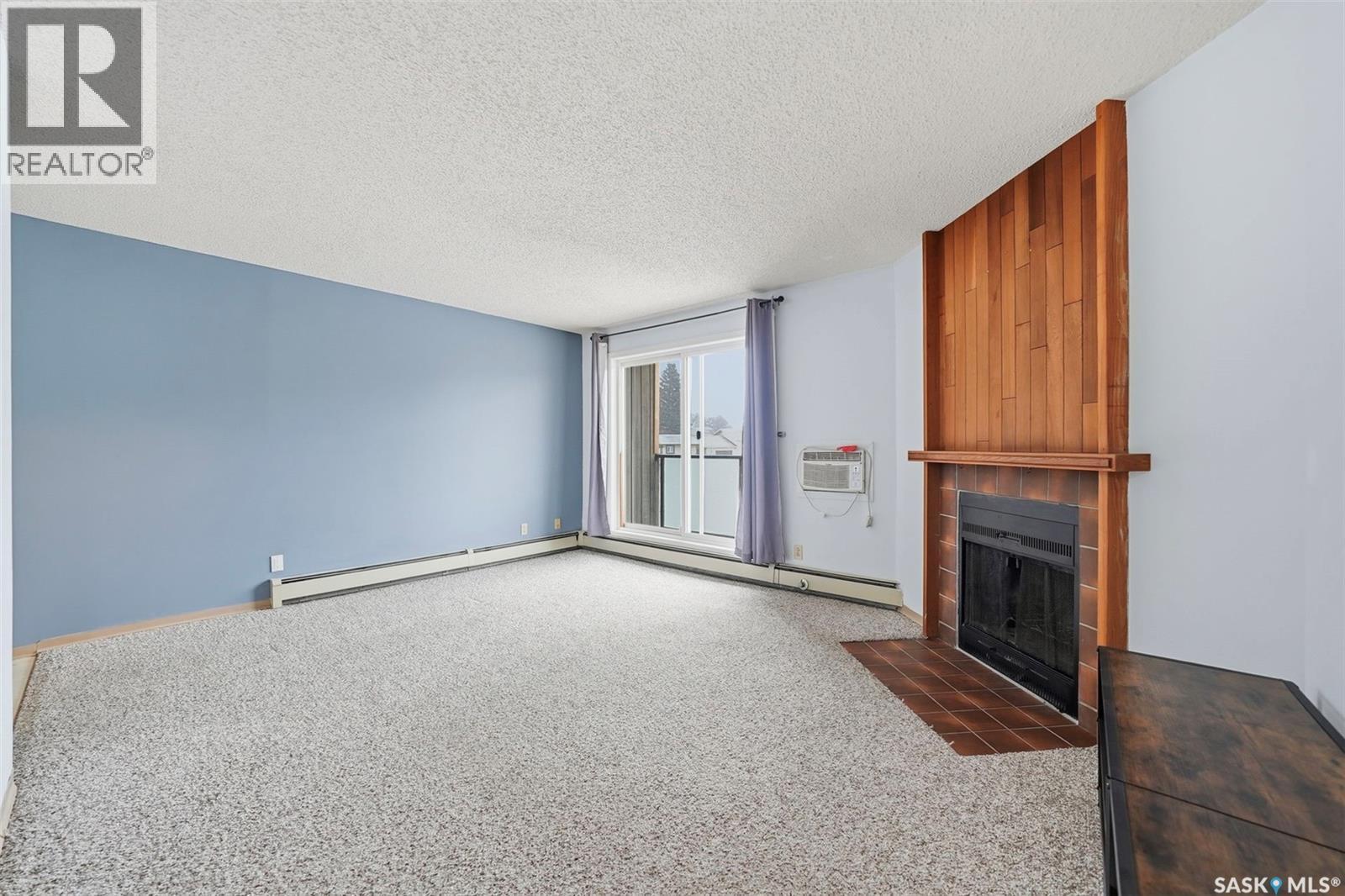 205 855 Wollaston Crescent, Saskatoon, SK - Indoor With Fireplace