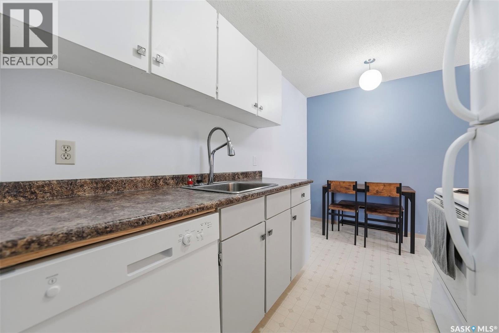 205 855 Wollaston Crescent, Saskatoon, SK - Indoor Photo Showing Kitchen With Double Sink