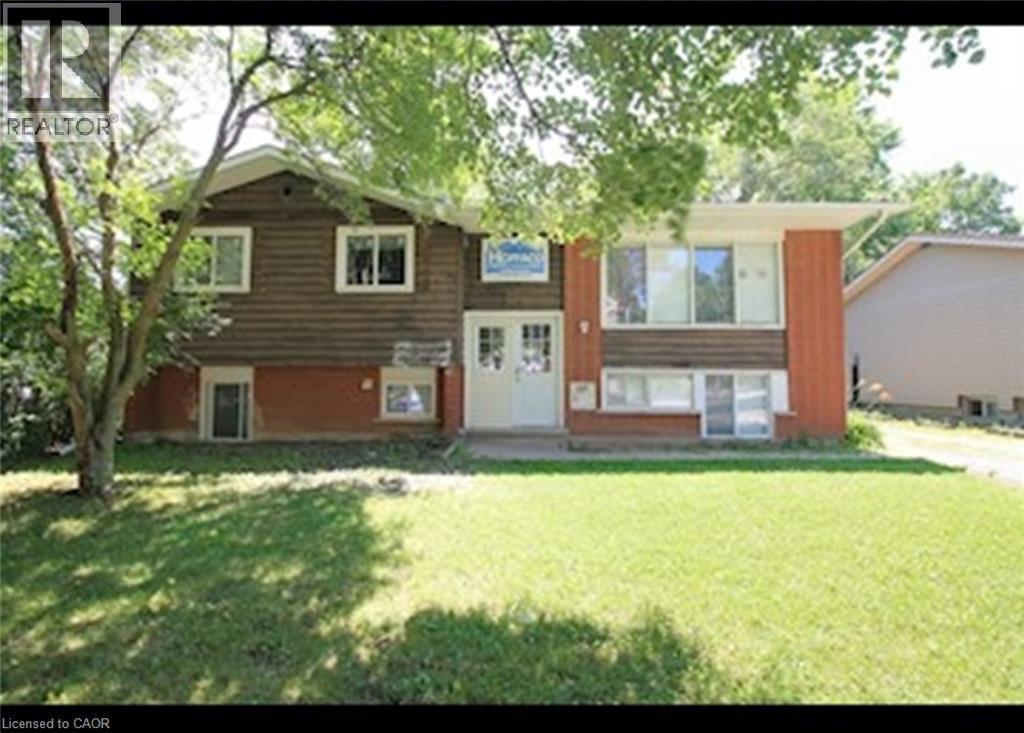 View of front of house with a front yard - 65 Cardill Crescent Unit# A, Waterloo, ON - Outdoor
