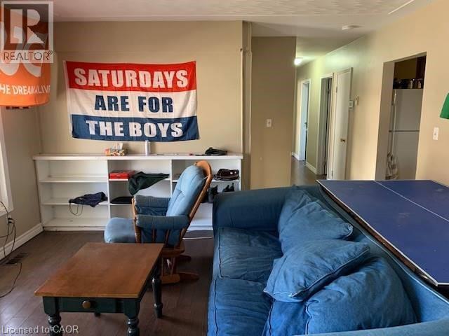 Rec room featuring wood finished floors and baseboards - 65 Cardill Crescent Unit# A, Waterloo, ON - Indoor