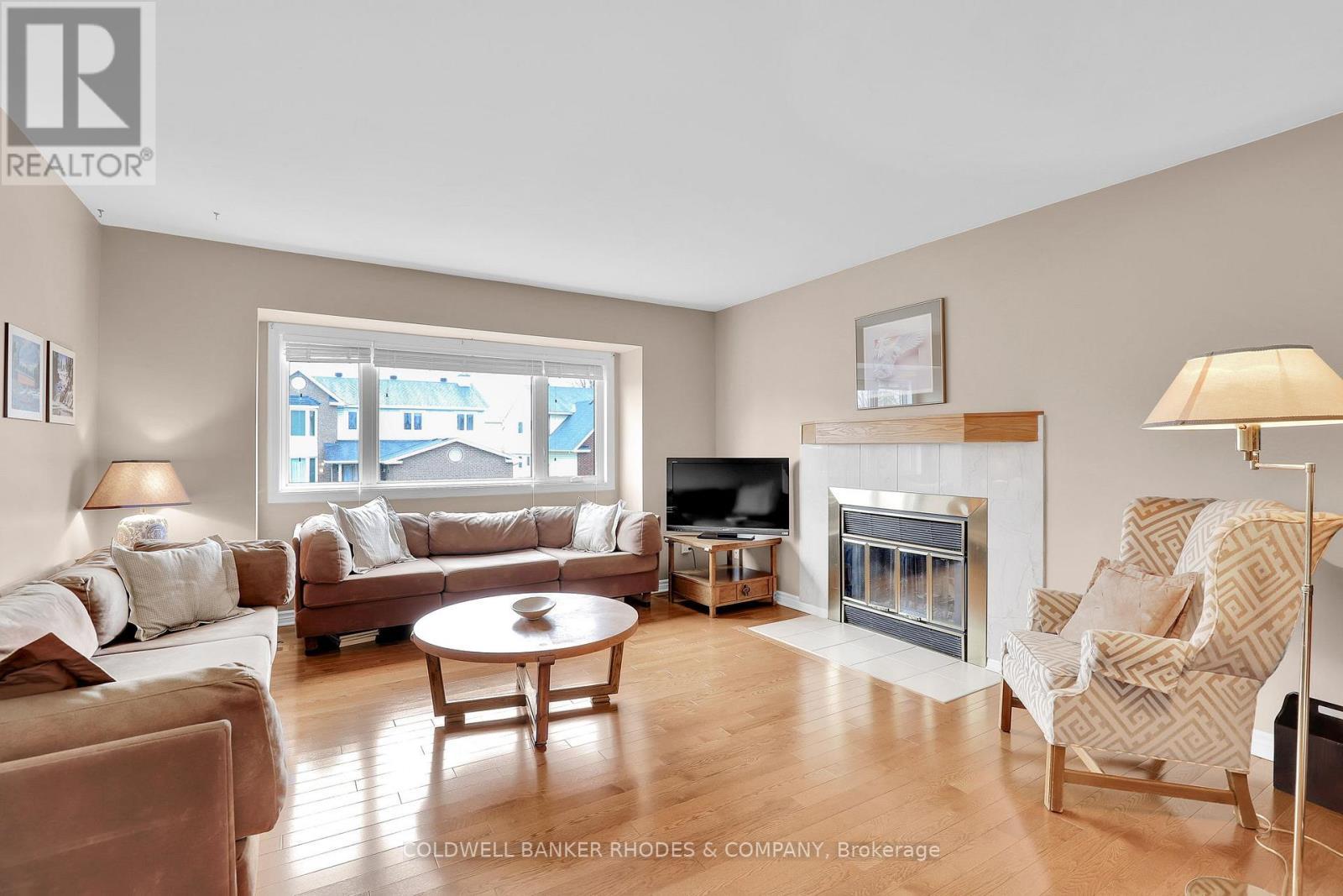 73 Bramblegrove Crescent, Ottawa, ON - Indoor Photo Showing Living Room With Fireplace