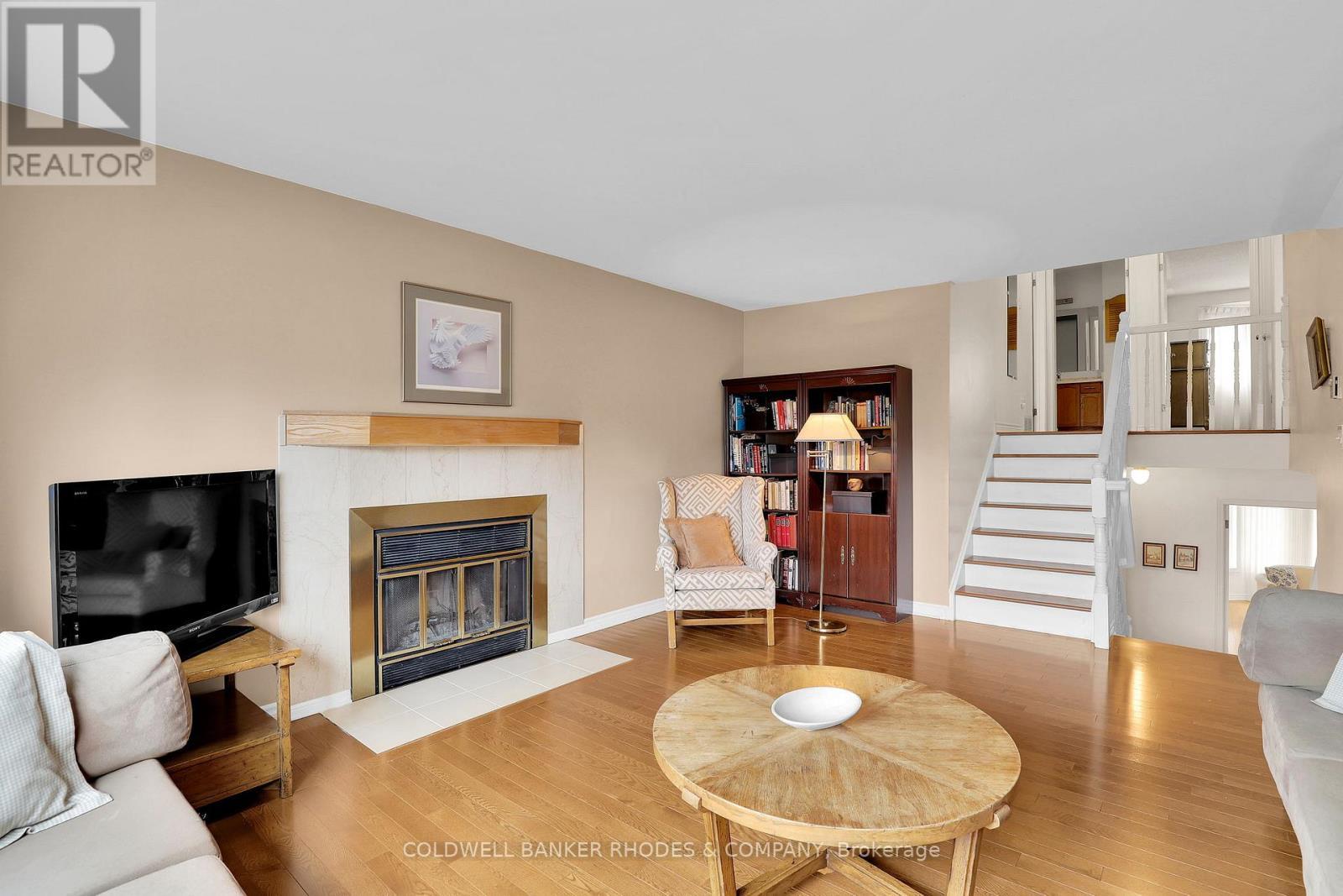 73 Bramblegrove Crescent, Ottawa, ON - Indoor Photo Showing Living Room With Fireplace