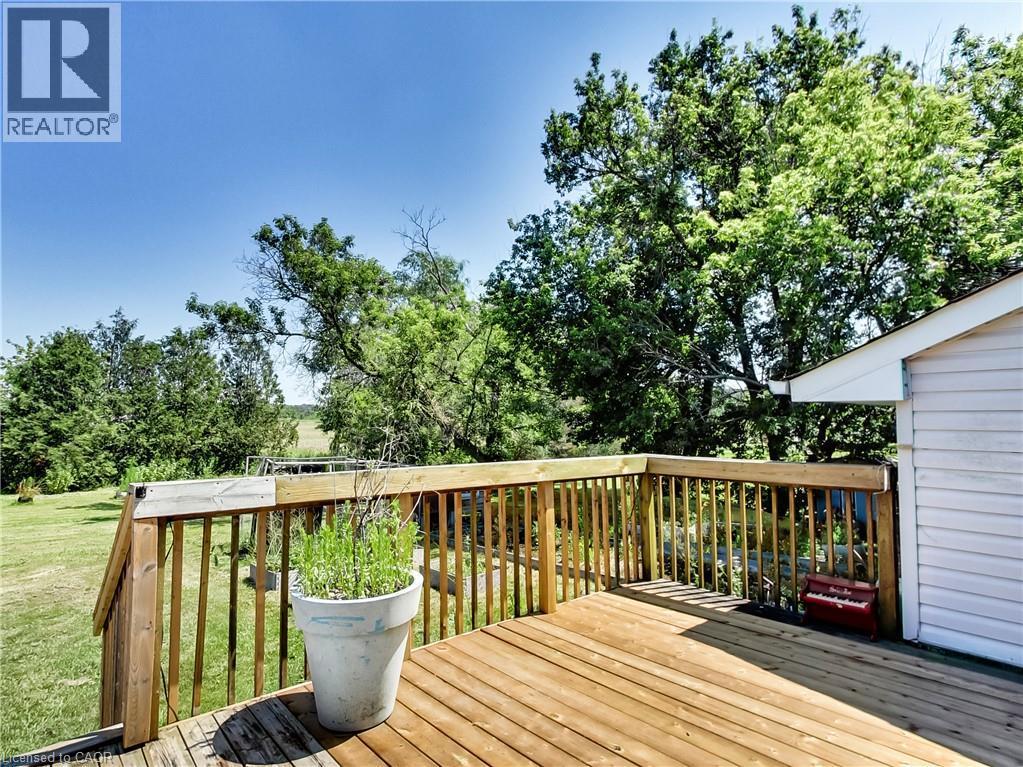 Spacious outdoor wood deck with natural wood railing, offering expansive open-air enjoyment - 9183 Silver Street, Caistor Centre, ON - Outdoor With Deck Patio Veranda With Exterior