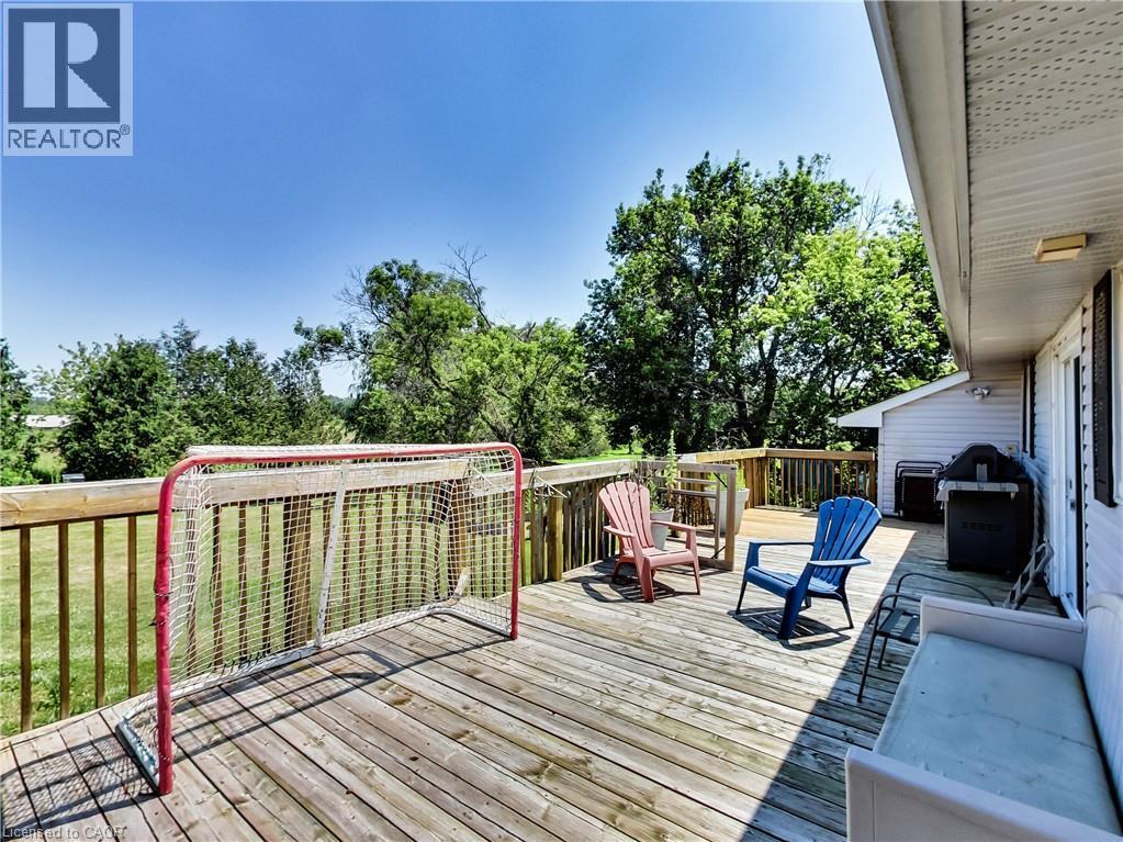 Expansive outdoor wood deck with a perimeter railing - 9183 Silver Street, Caistor Centre, ON - Outdoor With Deck Patio Veranda With Exterior