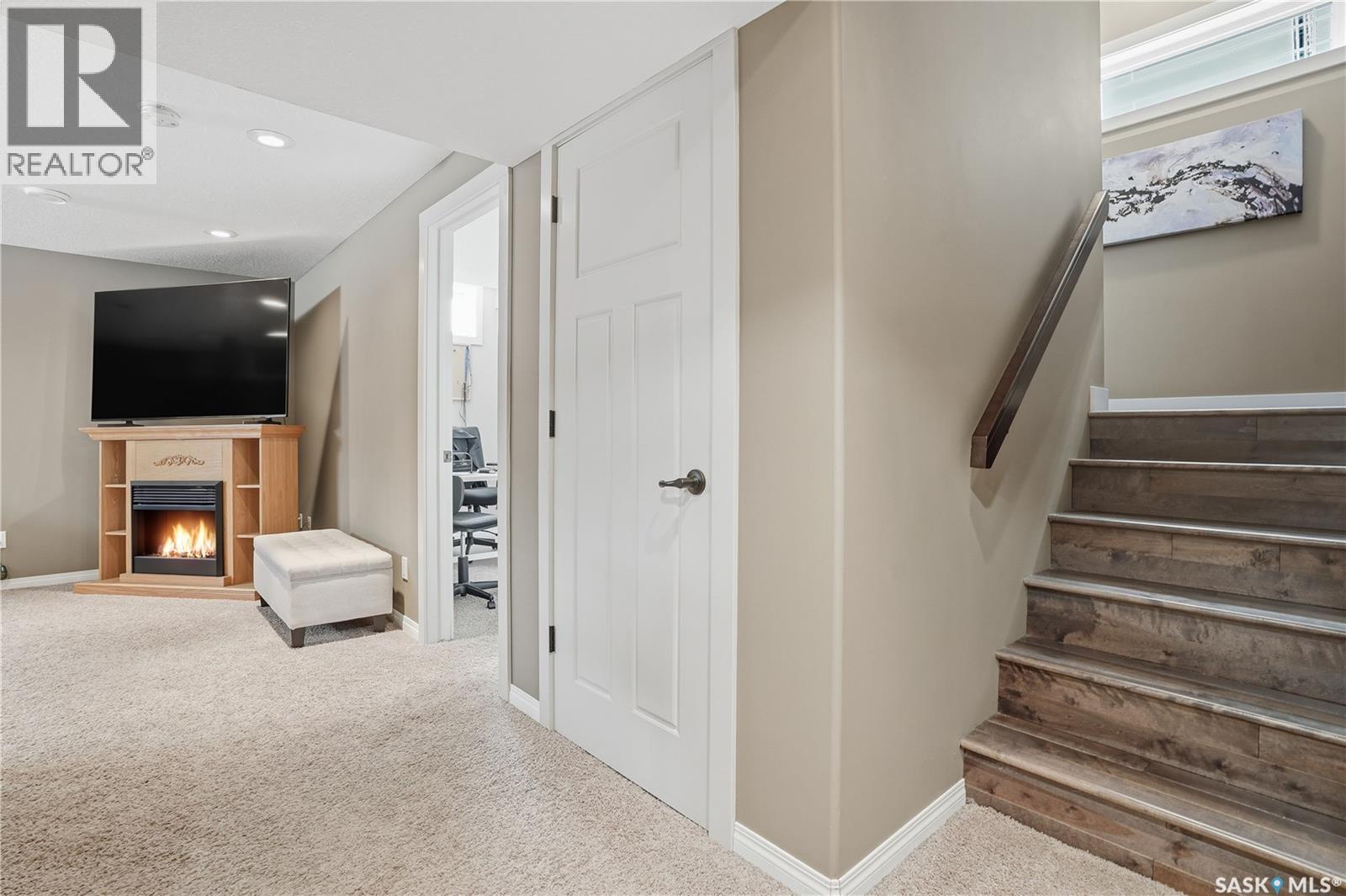 1532 Maple Hill Crescent N, Regina, SK - Indoor Photo Showing Other Room With Fireplace