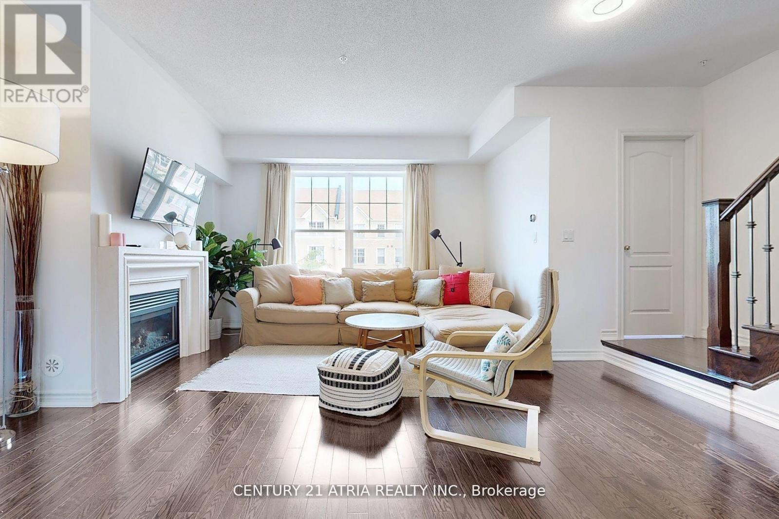 17 Cathedral High Street, Markham, ON - Indoor Photo Showing Living Room With Fireplace