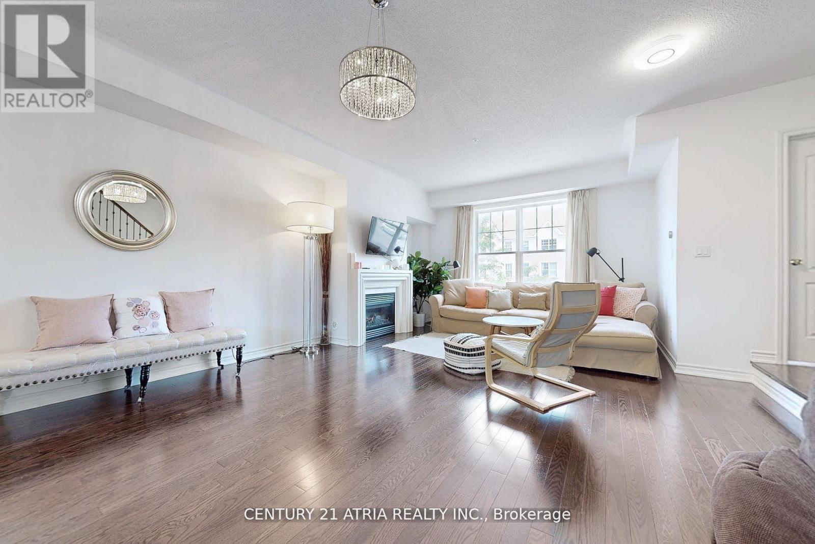 17 Cathedral High Street, Markham, ON - Indoor Photo Showing Living Room With Fireplace