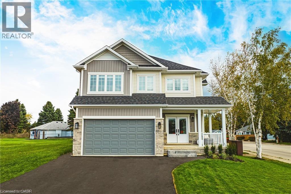 This property features a two-story exterior with light-colored siding, a dark roof, and an attached two-car garage - Lot 9 Kellogg Avenue, Hamilton, ON - Outdoor With Facade