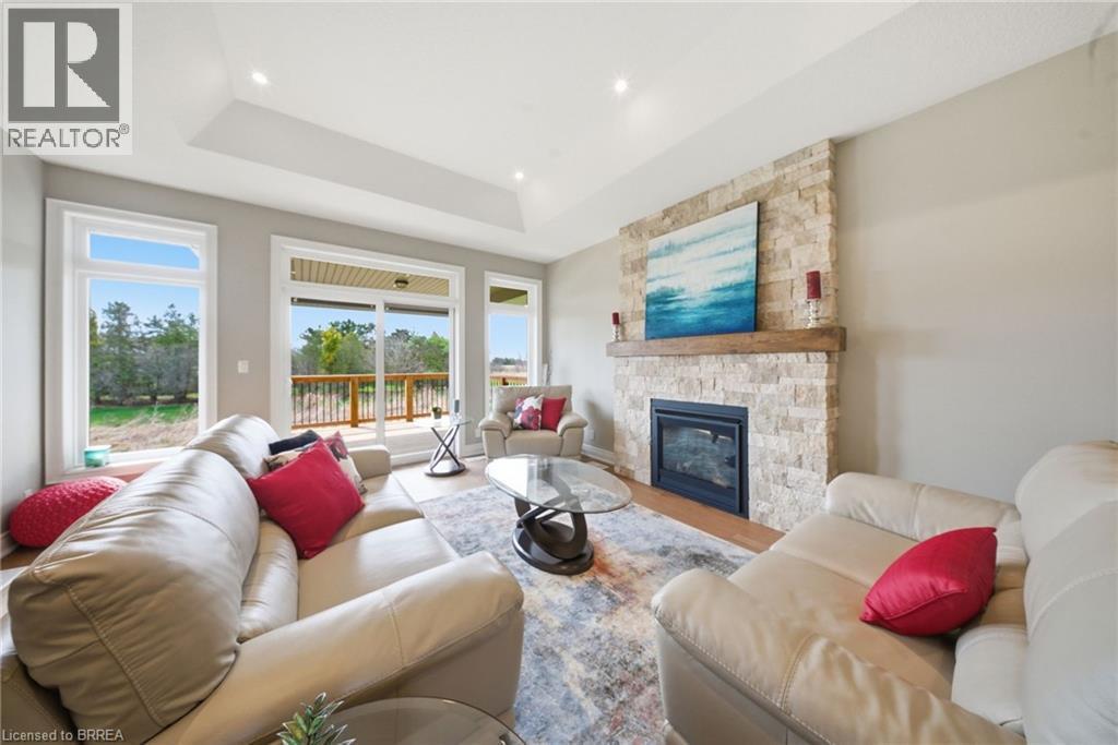 105 Craddock Boulevard, Jarvis, ON - Indoor Photo Showing Living Room With Fireplace