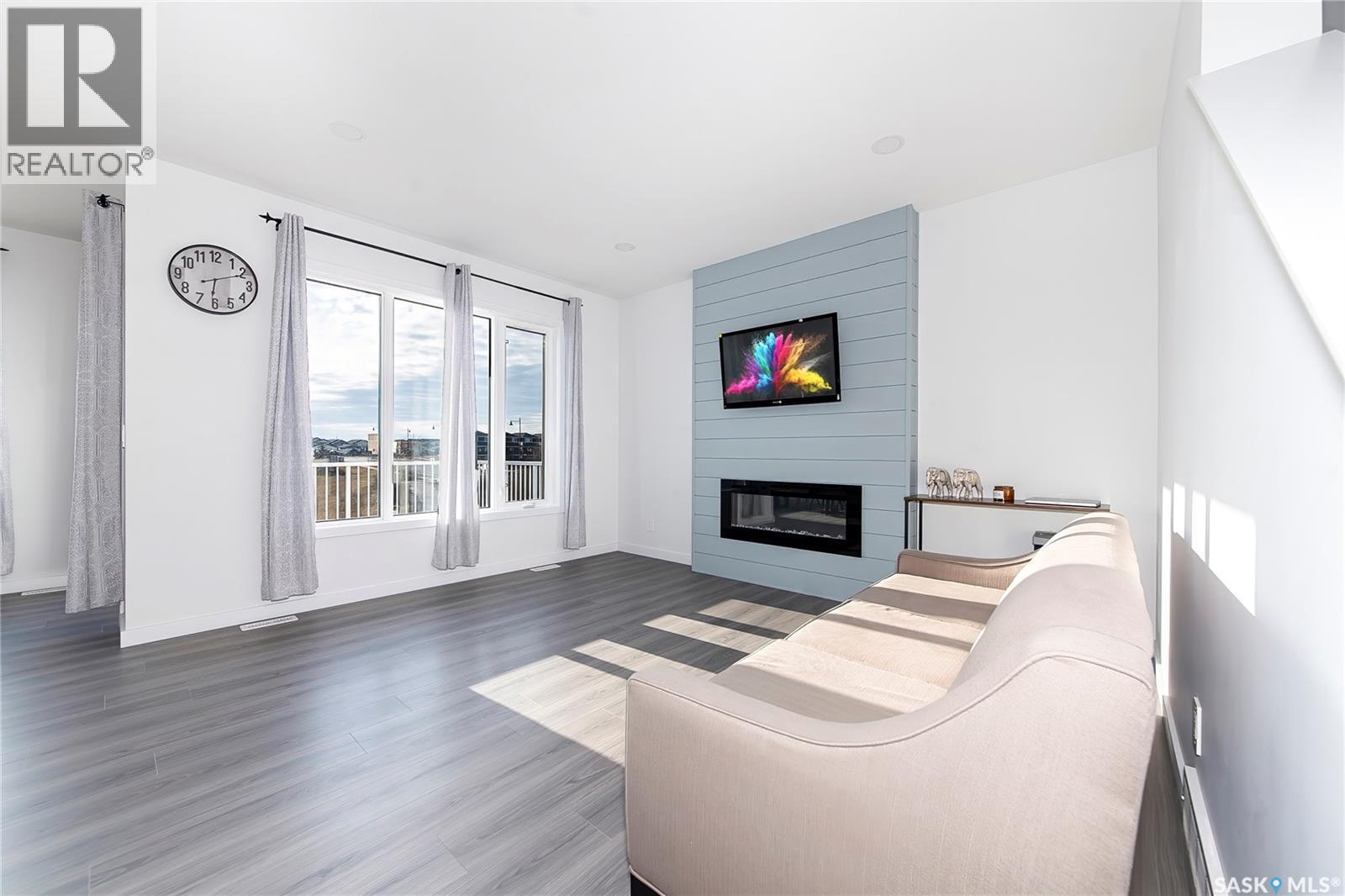 1038 Childers Court, Saskatoon, SK - Indoor Photo Showing Living Room With Fireplace