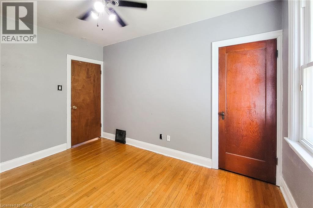 Hardwood flooring and light grey walls - 66 Cline Avenue Unit# Main Floor, Hamilton, ON - Indoor Photo Showing Other Room