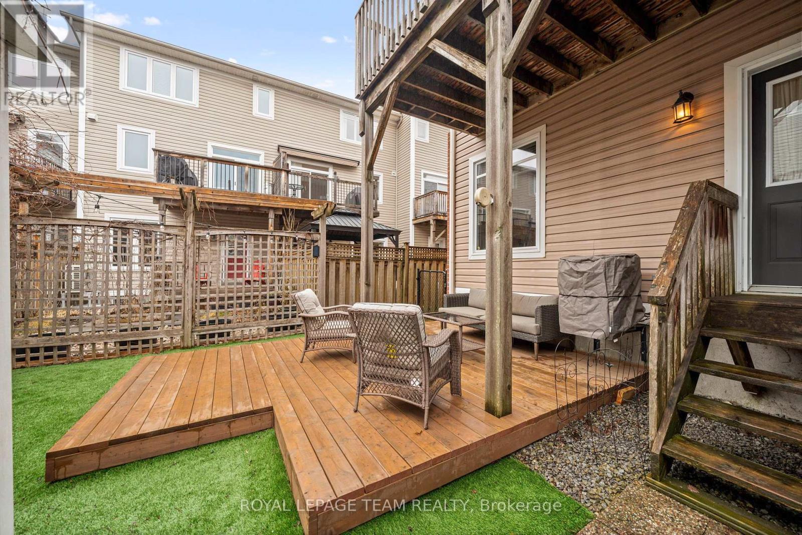 Backyard w new deck and turf - 173 West Village Private, Ottawa, ON - Outdoor With Deck Patio Veranda With Exterior