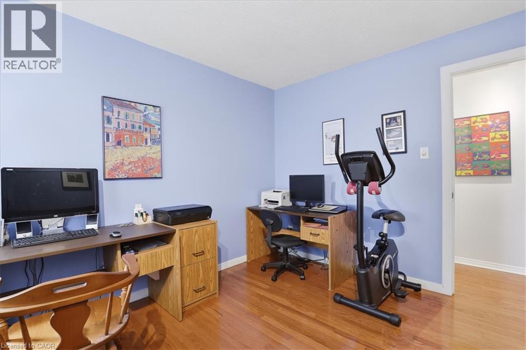 This room features hardwood flooring and light blue walls - 110 Milton Avenue, Cambridge, ON - Indoor