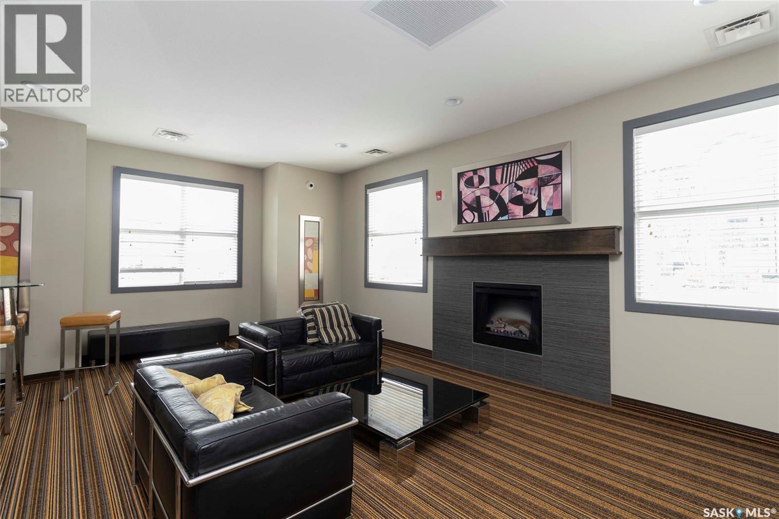 307A 415 Hunter Road, Saskatoon, SK - Indoor Photo Showing Living Room With Fireplace