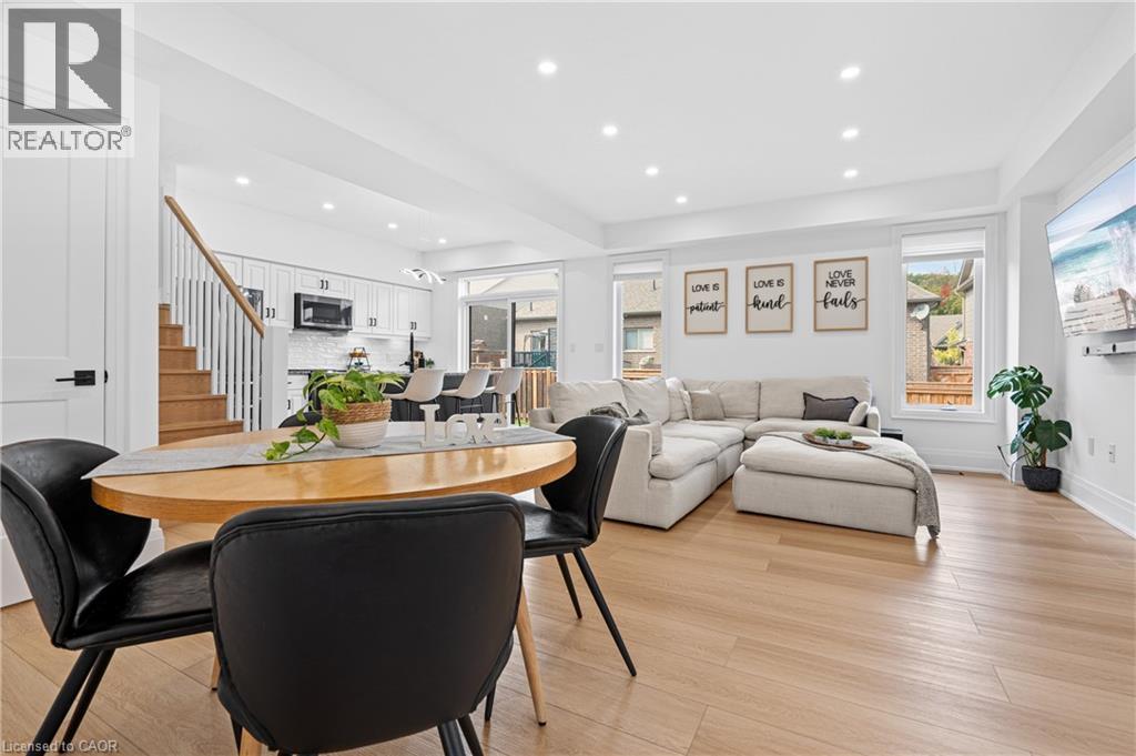 Bright open-concept living space with light wood-finish flooring - 1026 Wright Drive, Midland, ON - Indoor