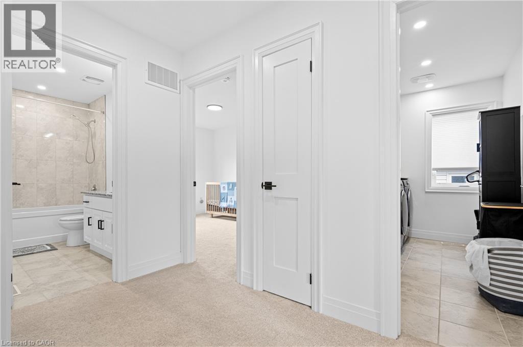 Carpeted hallway with white walls and recessed lighting - 1026 Wright Drive, Midland, ON - Indoor