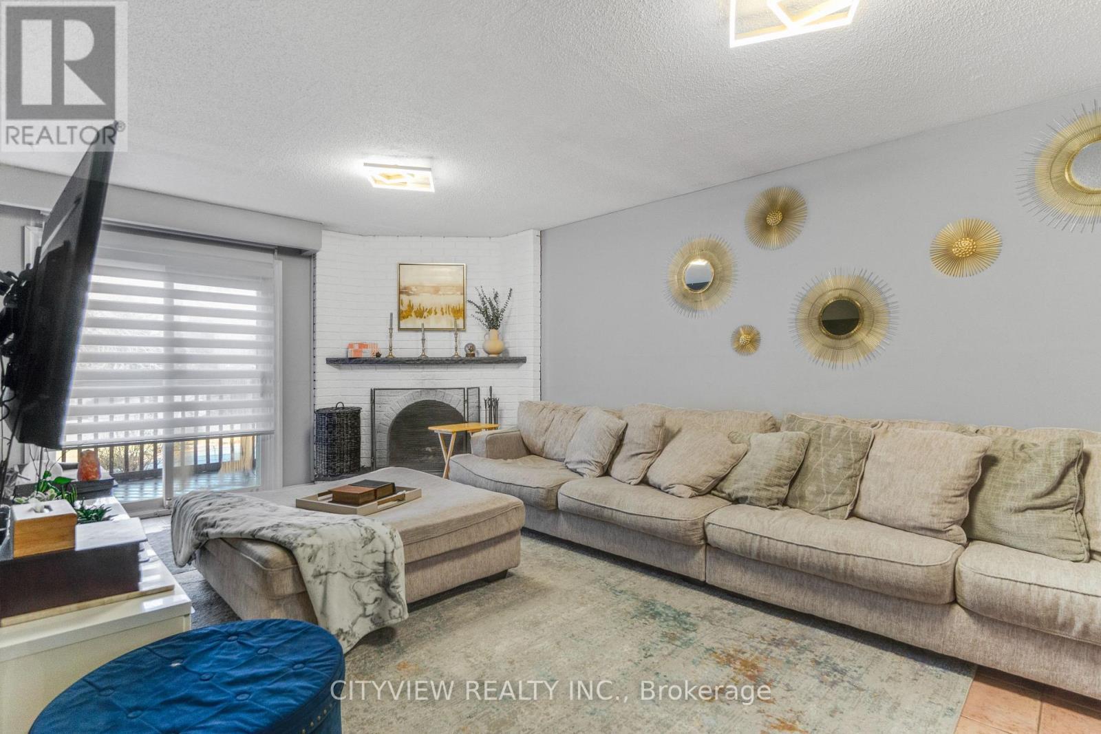 64 Foxacre Row, Brampton, ON - Indoor Photo Showing Living Room With Fireplace