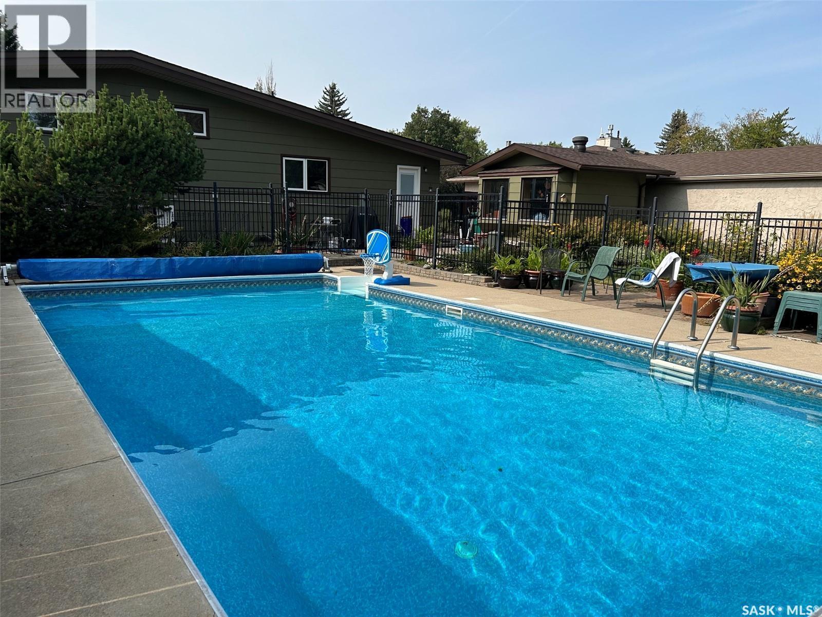 117 Mount Allison Crescent, Saskatoon, SK - Outdoor With In Ground Pool With Backyard