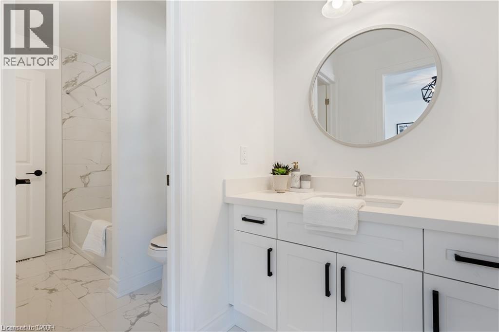 Bathroom with vanity and light marble finish flooring - 66 Cesar Place, Ancaster, ON - Indoor Photo Showing Bathroom