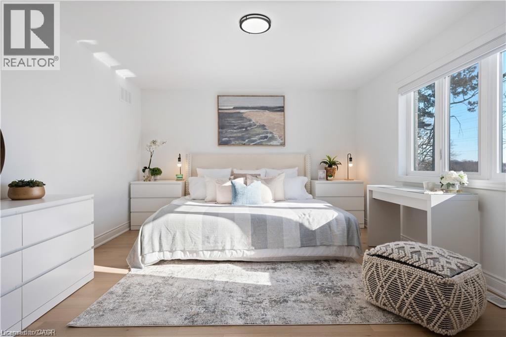 Bedroom featuring light wood finished floors and baseboards - 66 Cesar Place, Ancaster, ON - Indoor Photo Showing Bedroom