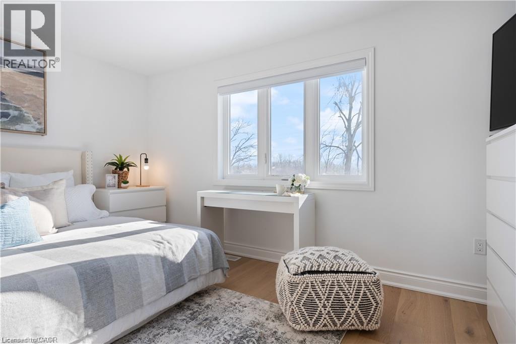 Bedroom with light wood-style floors - 66 Cesar Place, Ancaster, ON - Indoor Photo Showing Bedroom