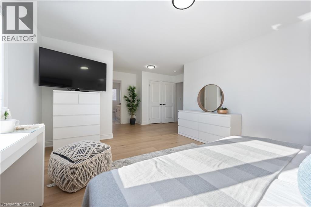Bedroom featuring light wood-type flooring - 66 Cesar Place, Ancaster, ON - Indoor