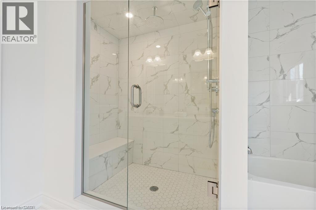 Bathroom with a marble finish shower and a garden tub - 66 Cesar Place, Ancaster, ON - Indoor Photo Showing Bathroom