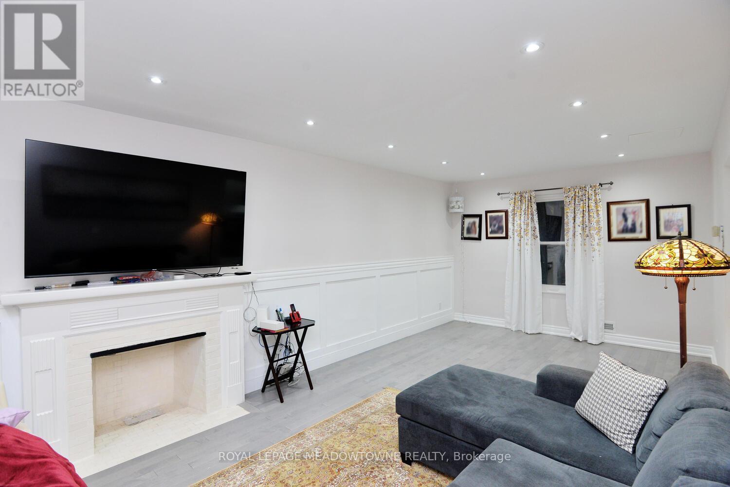 825 North Service Road, Mississauga, ON - Indoor Photo Showing Living Room With Fireplace