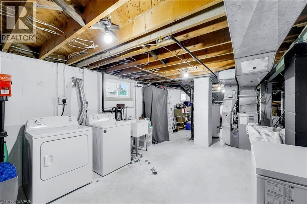 Utility area featuring exposed ceiling joists and ductwork - 18 Tweedsmuir Avenue, London, ON - Indoor Photo Showing Laundry Room