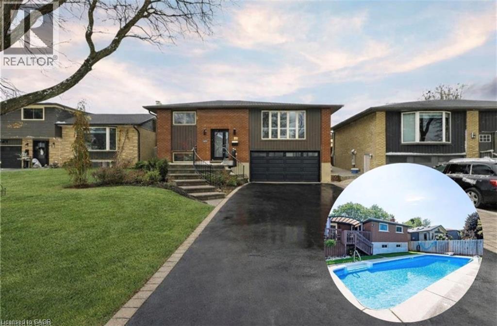 This property features a well-maintained front lawn, an attached garage, and a paved driveway leading to stone steps - 364 Roselawn Place, Waterloo, ON - Outdoor With Facade
