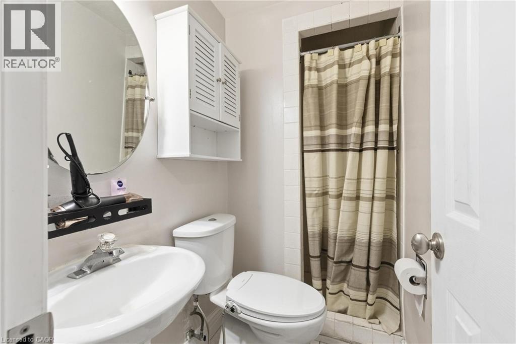Bathroom with a shower with shower curtain and a sink - 364 Roselawn Place, Waterloo, ON - Indoor Photo Showing Bathroom