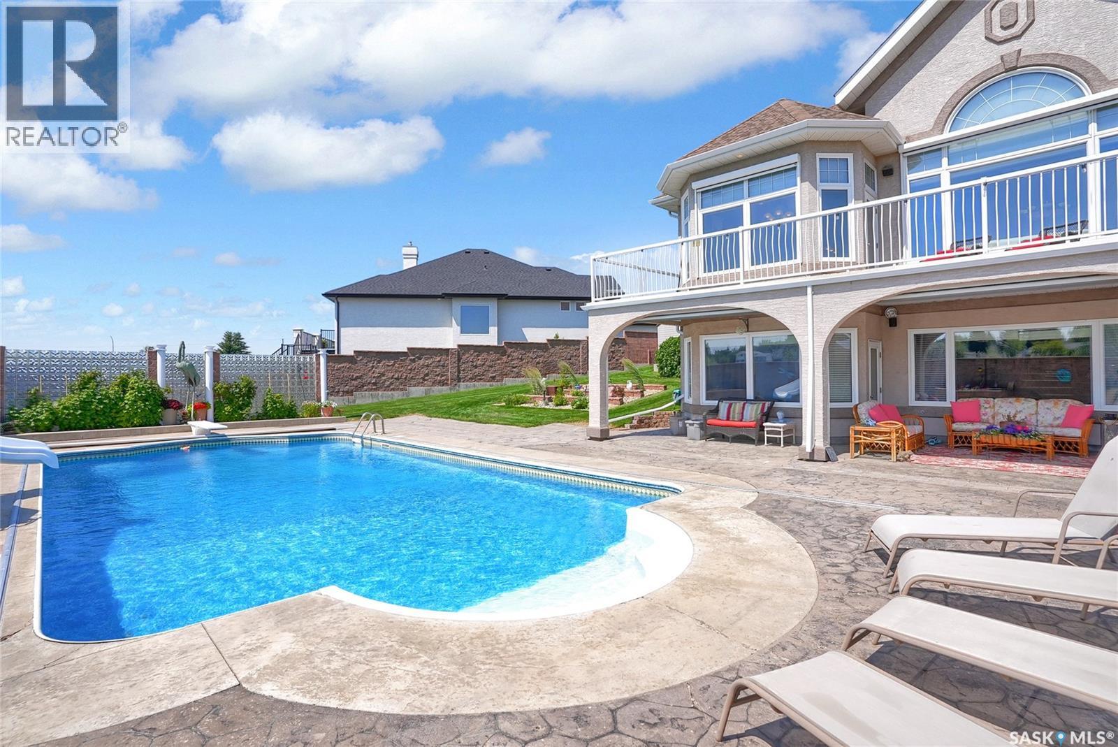 1453 Normandy Drive, Moose Jaw, SK - Outdoor With In Ground Pool With Deck Patio Veranda