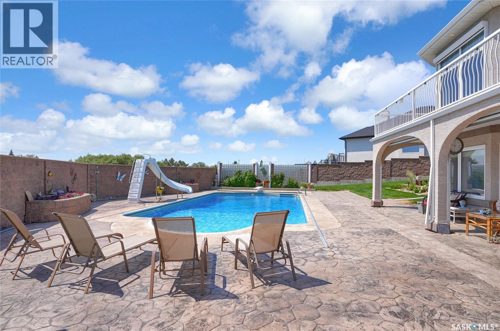 1453 Normandy Drive, Moose Jaw, SK - Outdoor With In Ground Pool With Deck Patio Veranda