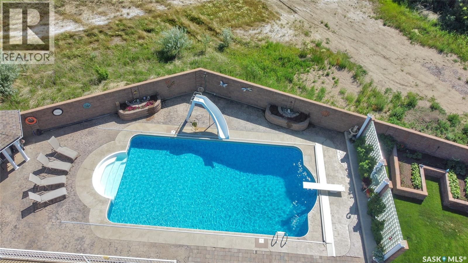 1453 Normandy Drive, Moose Jaw, SK - Outdoor With In Ground Pool