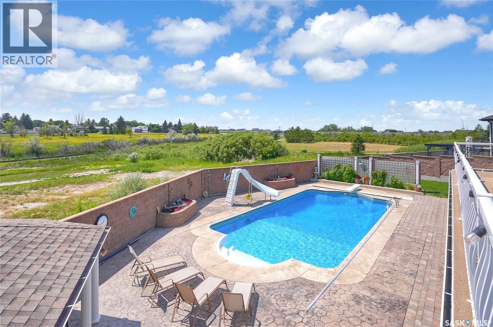 1453 Normandy Drive, Moose Jaw, SK - Outdoor With In Ground Pool With Deck Patio Veranda With View