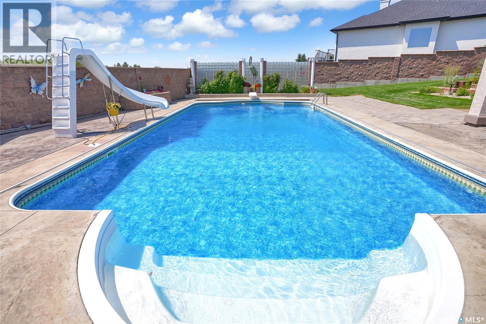 1453 Normandy Drive, Moose Jaw, SK - Outdoor With In Ground Pool With Deck Patio Veranda