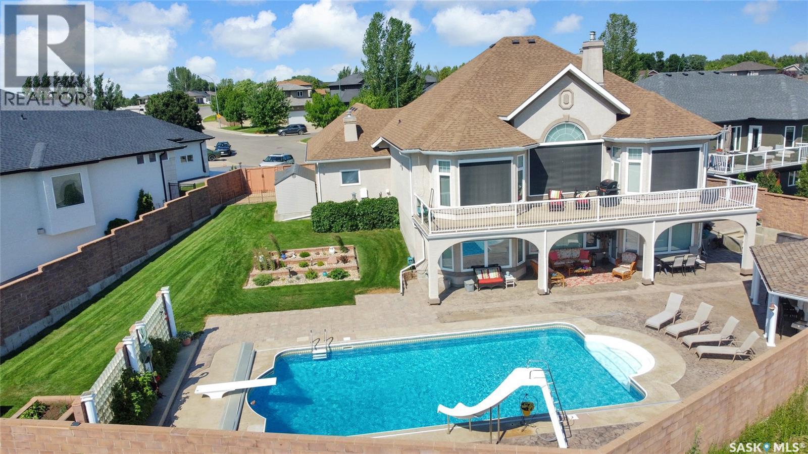 1453 Normandy Drive, Moose Jaw, SK - Outdoor With In Ground Pool With Deck Patio Veranda