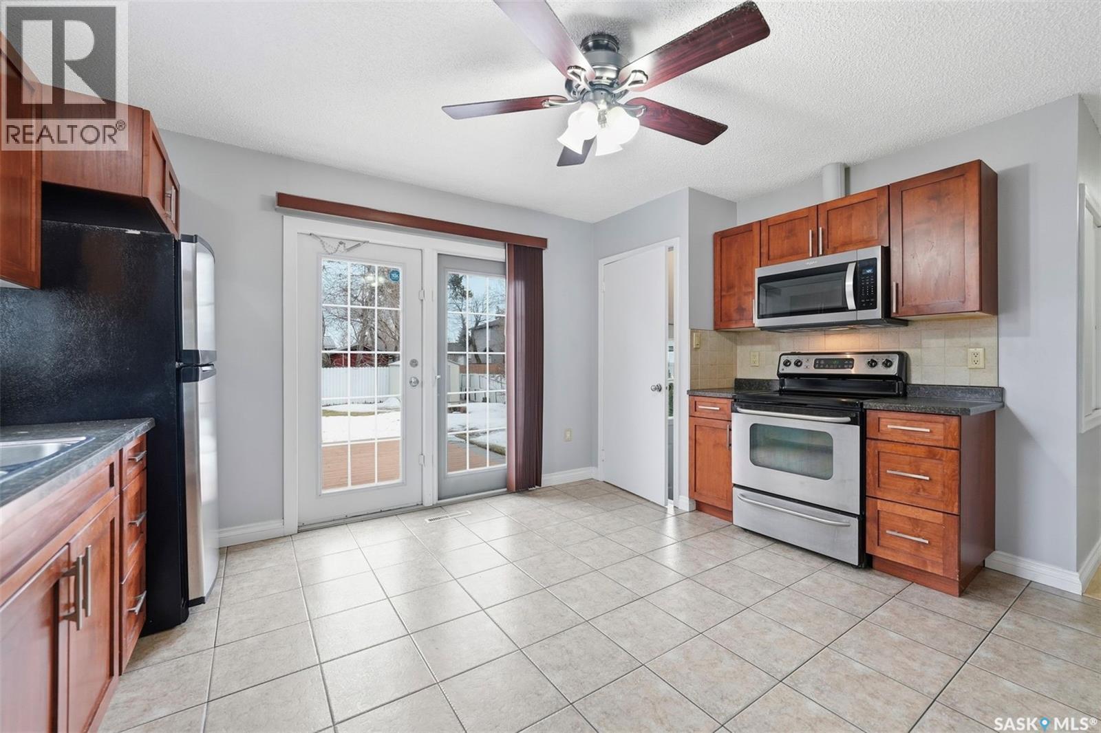 107 Evans Street, Saskatoon, SK - Indoor Photo Showing Kitchen With Double Sink