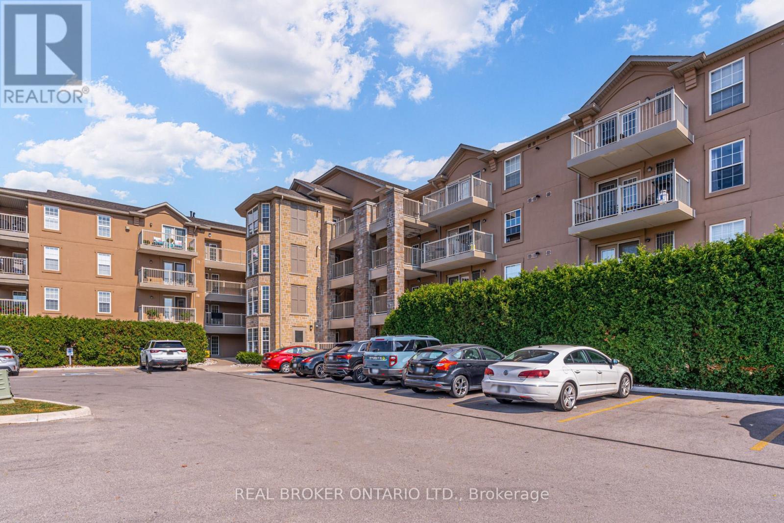313 - 1460 Bishops Gate, Oakville, ON - Outdoor With Balcony With Facade