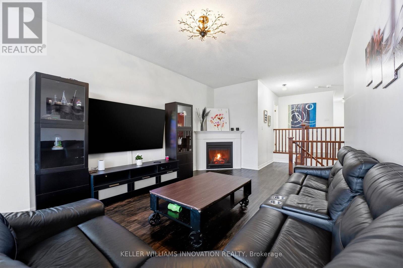420 Armstrong Street W, North Perth, ON - Indoor Photo Showing Living Room With Fireplace