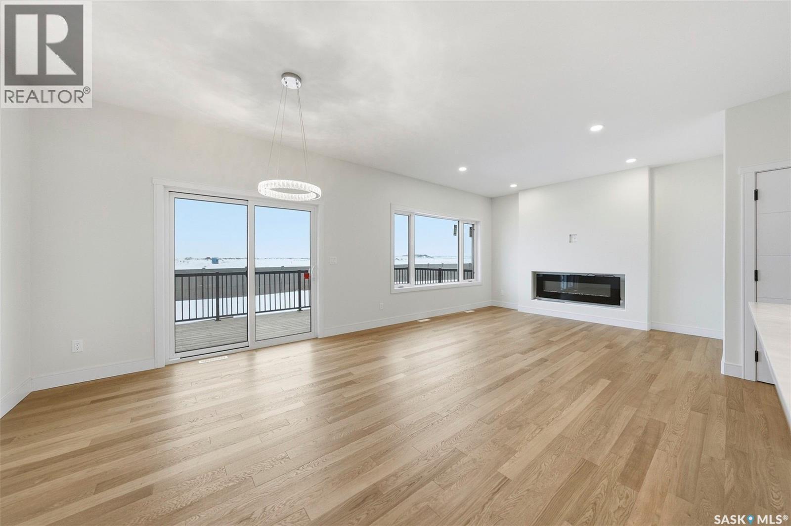 335 Sharma Crescent, Saskatoon, SK - Indoor Photo Showing Living Room With Fireplace