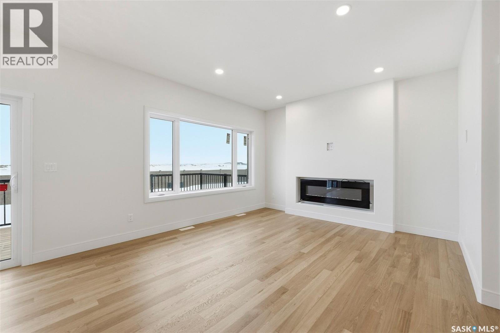 335 Sharma Crescent, Saskatoon, SK - Indoor Photo Showing Living Room With Fireplace