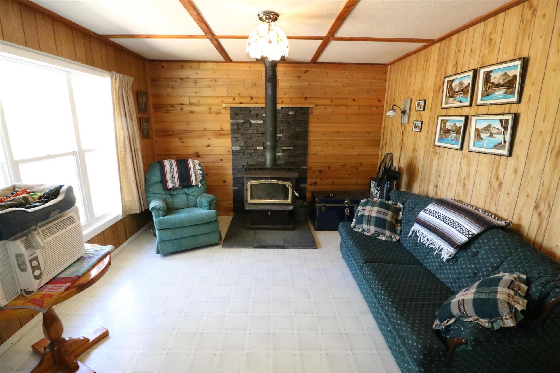 Cl4111 Winnipeg River, Kenora, ON - Indoor Photo Showing Other Room With Fireplace