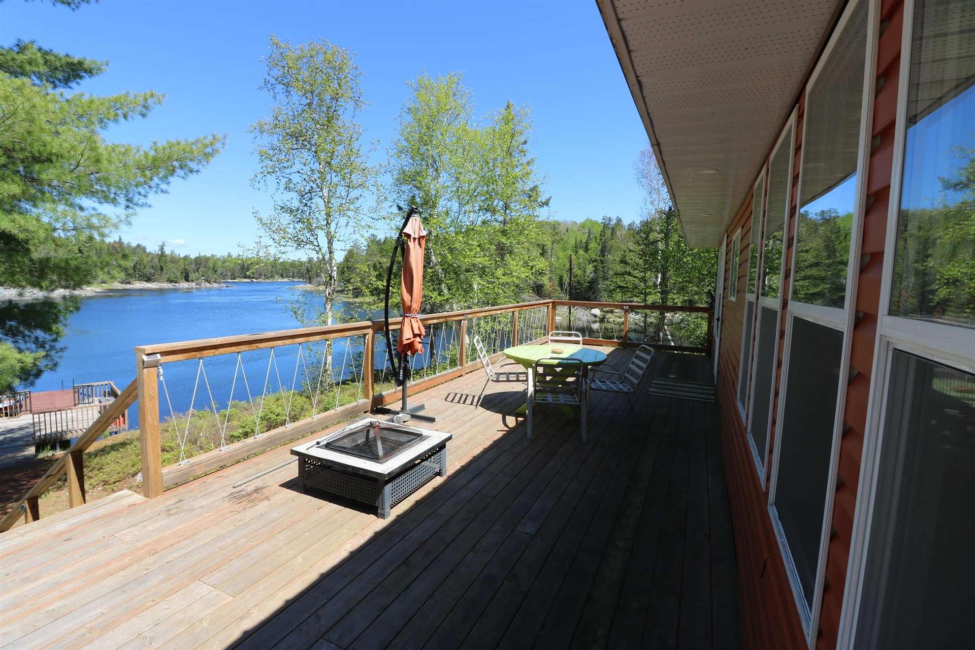 Cl4111 Winnipeg River, Kenora, ON - Outdoor With Body Of Water With Deck Patio Veranda With Exterior