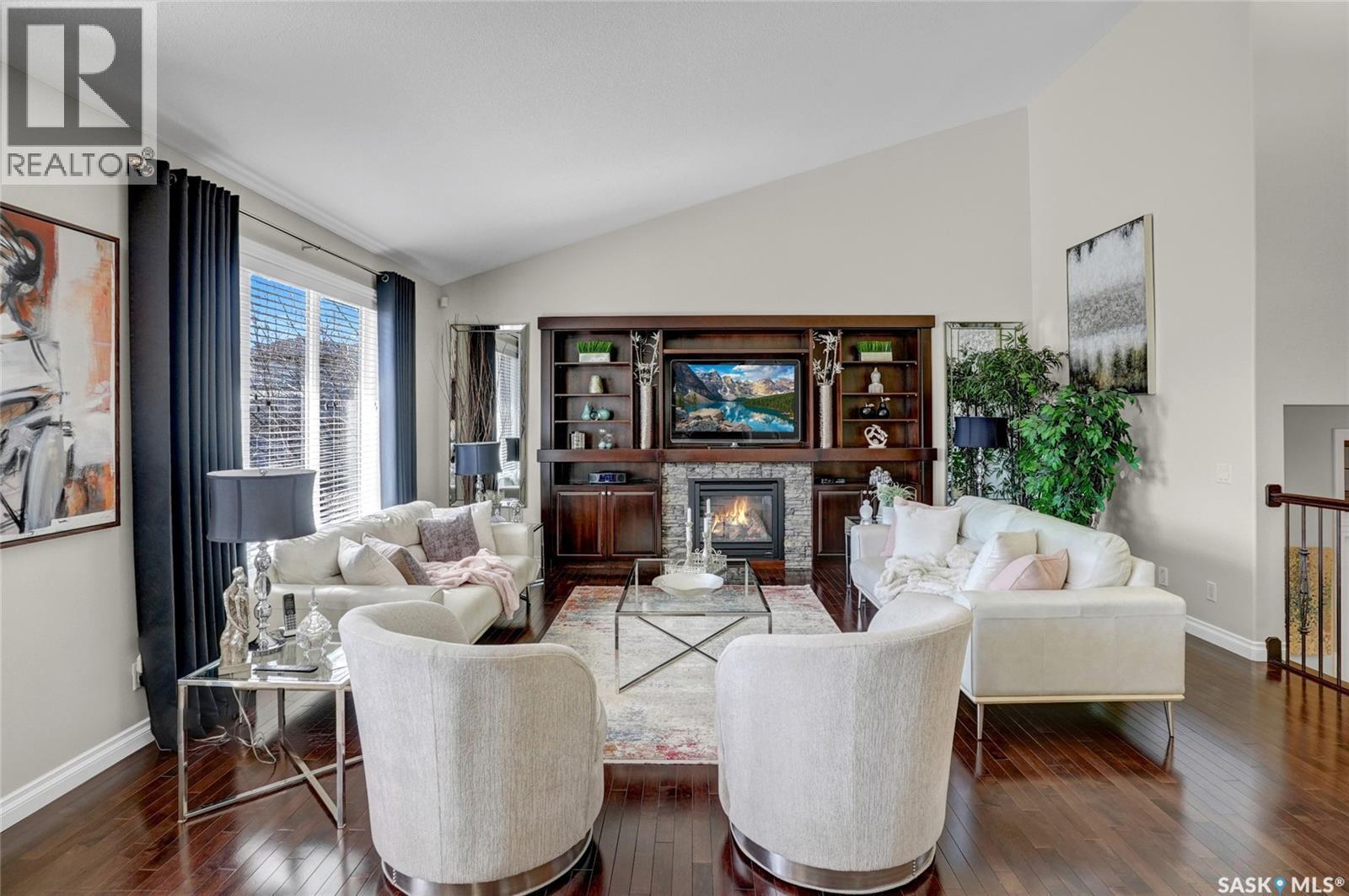 4839 Mazinke Crescent, Regina, SK - Indoor Photo Showing Living Room With Fireplace